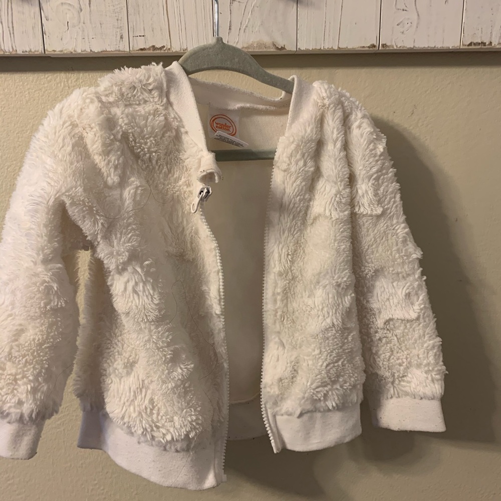 What furry light weight jacket. 18 months.